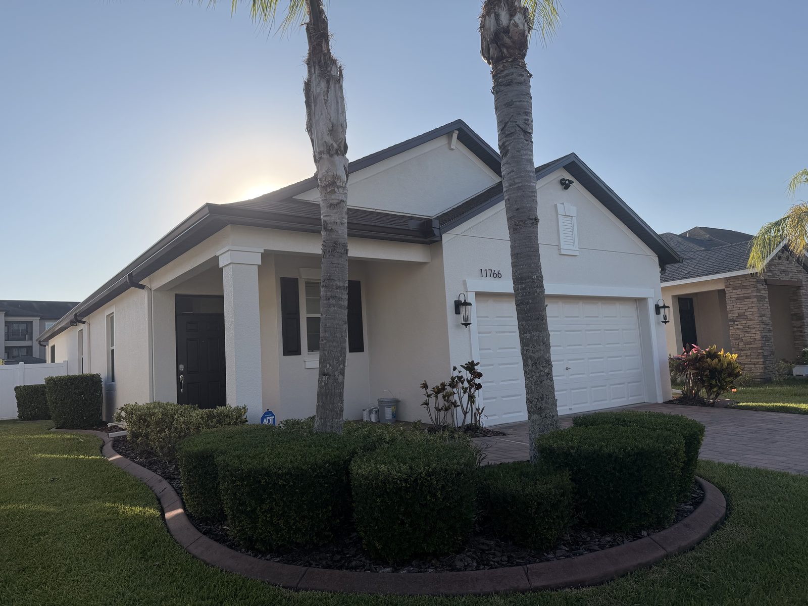 Freshly painted white Tampa home with attached garage