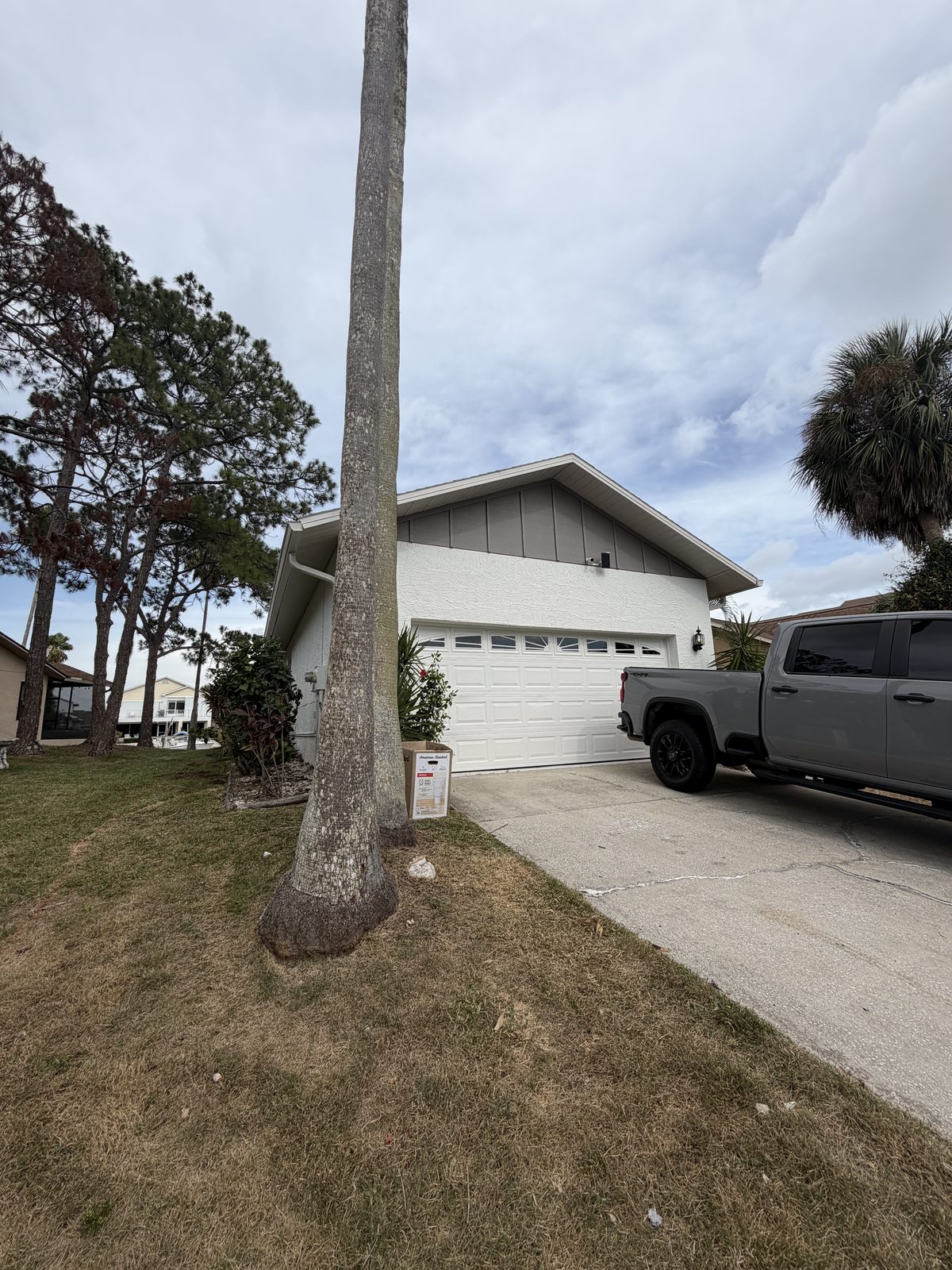 Two-car garage Florida home after Purple Painting exterior refresh