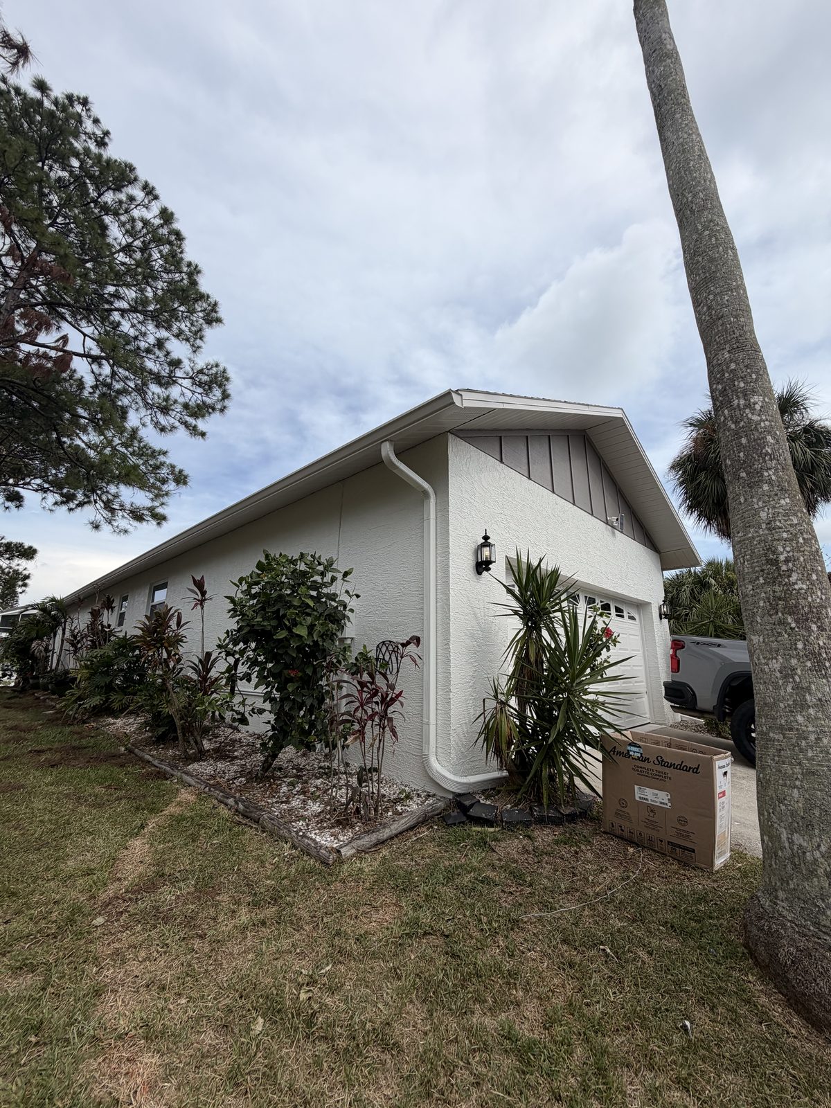 Purple Painting crew finishing an exterior repaint in Tampa