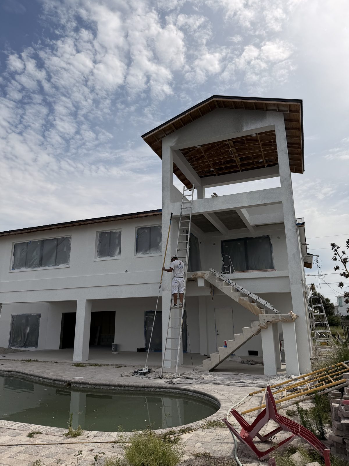 Large multi-story Tampa Bay home with pool after exterior repaint