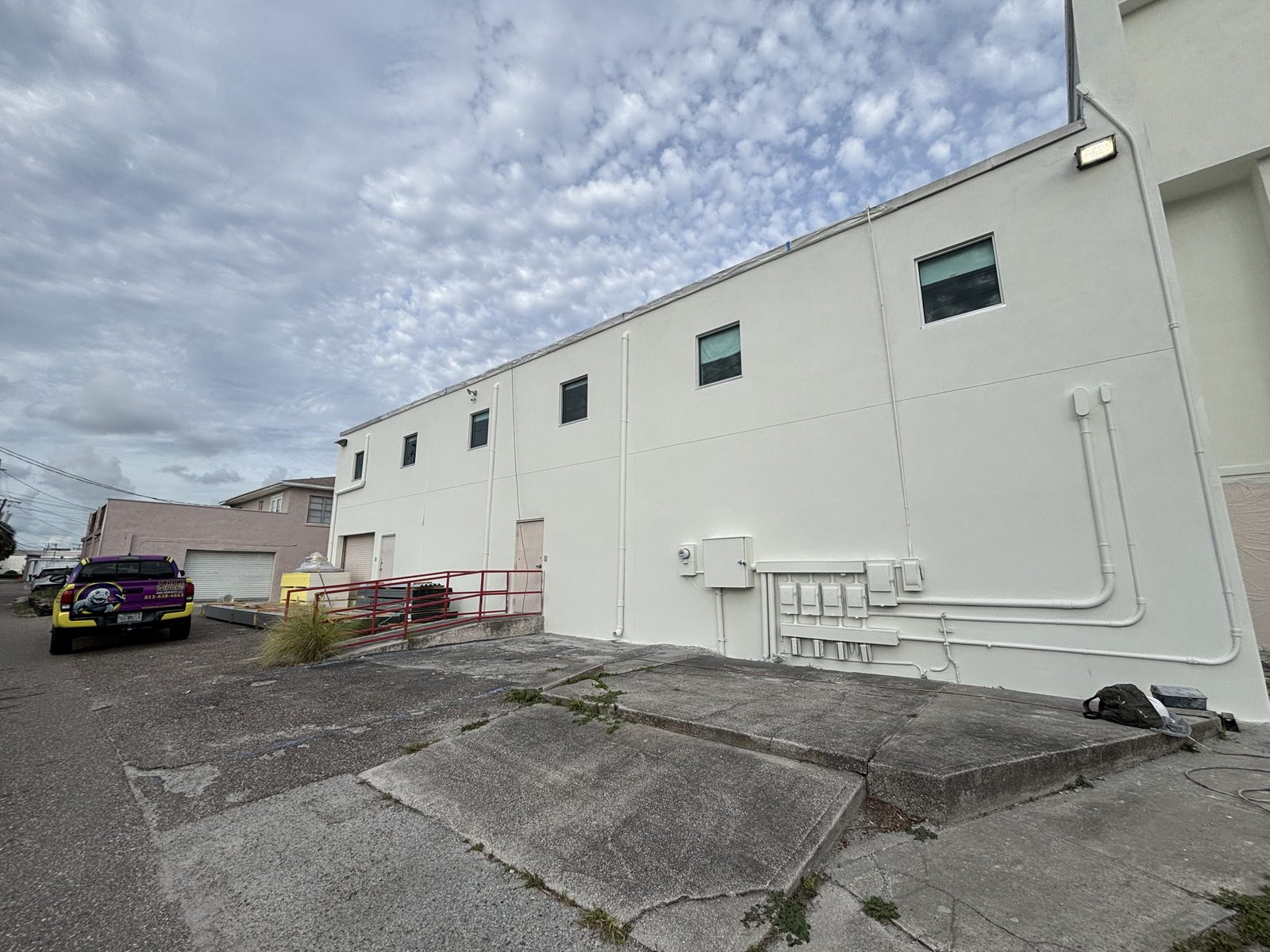 Commercial building exterior repainted by Purple Painting in Tampa